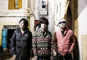 Picture of 3 band members from their Rebroadcast album