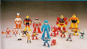 A lineup of action figures from the Ruby-Spears Mega Man cartoon. Left to right: Cutman, Elec Man, Protoman, Mega Man, Rush, Gutsman and Bombman