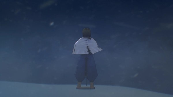 A lone, cloaked figure standing in a snow storm.
